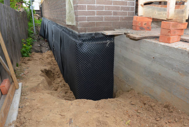 Happy homeowners after waterproofing job in Old Fort